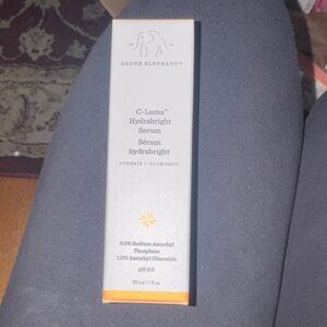 Drunk Elephant C-Luma Hydrabright Serum in Gray and Orange